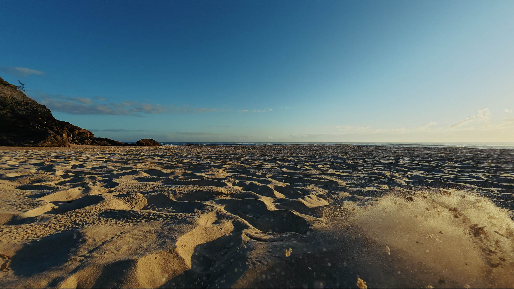 Kicking sand on the dune line at first light