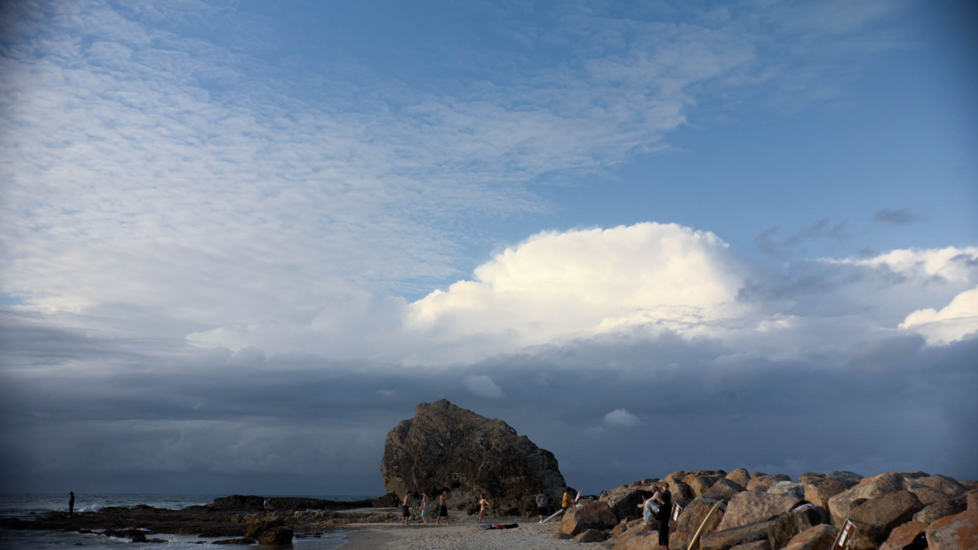 Big Rock at Currumbin under a stormy sky.
