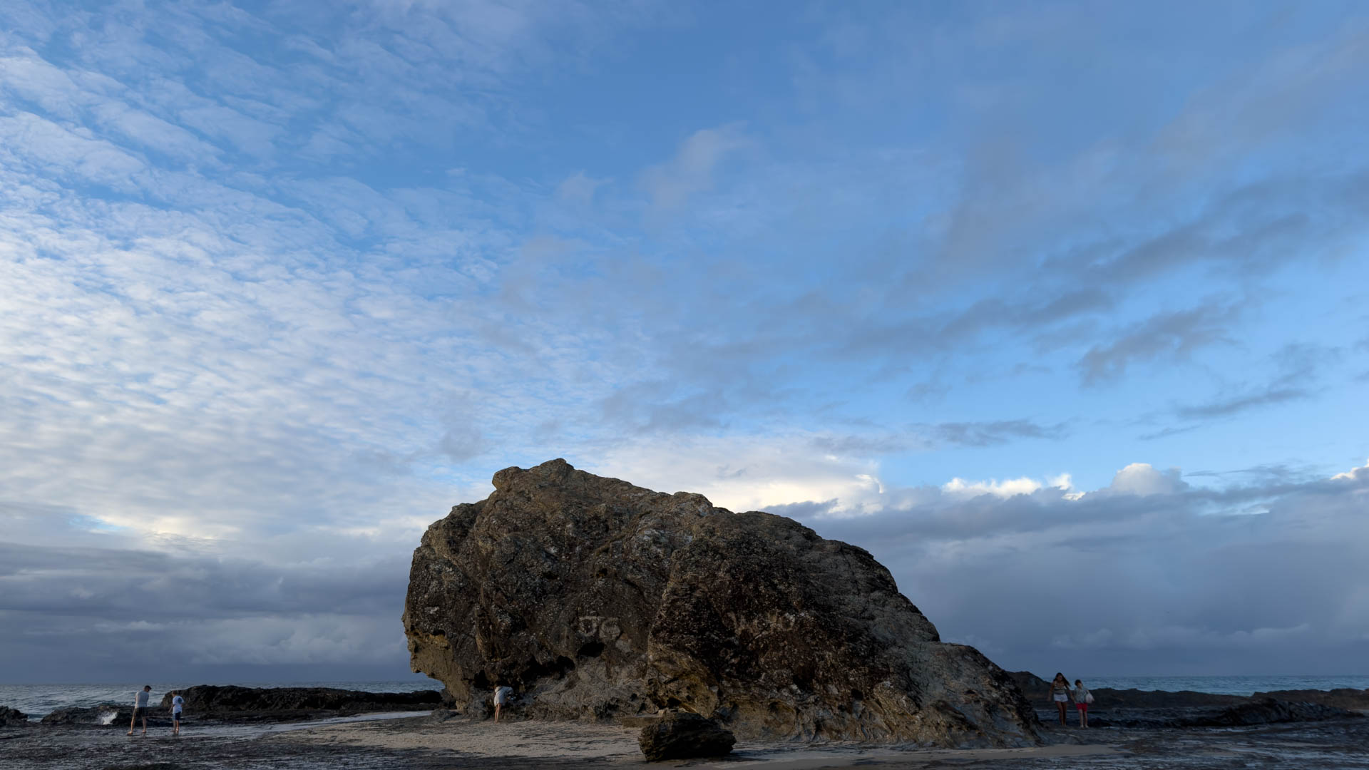The Currumbin coastline at the creek mouth, sand and surf running out toward the open sea.