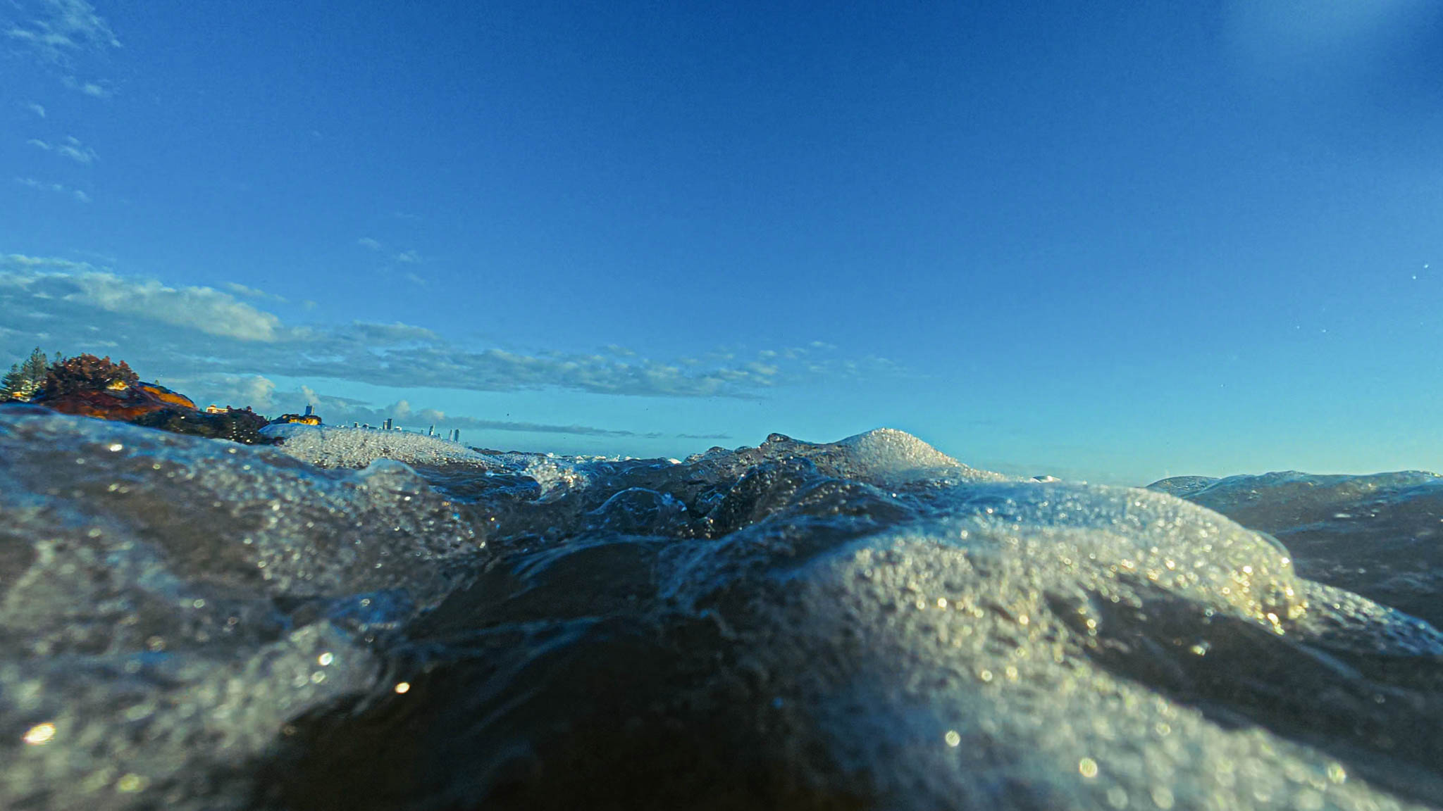 Foamy water and deep blue sky